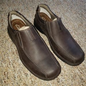 Dark brown and black Clarks loafers